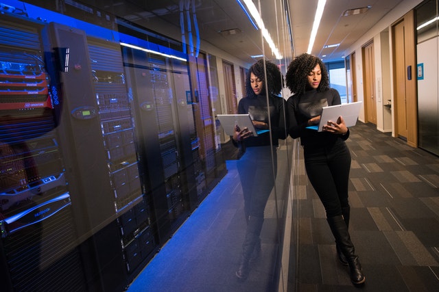 A woman standing next to a service provider's data centre