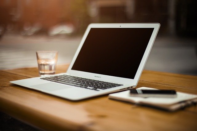 A laptop, a type of host, sitting on a desk