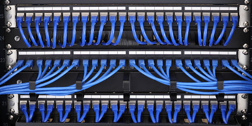 A few patch panels with network cables connected